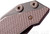 Rick Hinderer Knives Battle Field Pick Up Full Track Spear Point folding knife with flipper tab - close up of handle screws shown.  20CV stainless steel plain edge blade.  FDE G-10 handle with titanium lock side.  Model K208TSBFPU.
For reference only.
