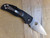 Blemished Native 5 folding knife with thumb hole - shown open pocket clip side.  Satin S30V stainless steel serrated edge blade.  Black FRN handle.  Model C41SBK5.