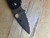 Blemished Native 5 folding knife with thumb hole - close up of presentation side blade shown.  Satin S30V stainless steel serrated edge blade.  Black FRN handle.  Model C41SBK5.