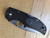Blemished Native 5 folding knife with thumb hole - shown closed presentation side.  Satin S30V stainless steel serrated edge blade.  Black FRN handle.  Model C41SBK5.