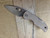 Blemished Spyderco Native 5 folding knife with thumb hole - shown open presentation side.  Satin CPM CruWear steel plain edge blade.  Brown Micarta handle.  Model C41MPCW5.