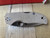 Blemished Spyderco Native 5 folding knife with thumb hole - shown closed presentation side.  Satin CPM CruWear steel plain edge blade.  Brown Micarta handle.  Model C41MPCW5.