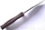 Rick Hinderer Knives The Ranch Bowie fixed blade knife - shown out of sheath top view.  Stonewash 3V steel plain edge blade.  Burgundy Micarta handle.  Model K605RS000. 