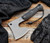 RMJ Tactical Bushcraft Axe - shown out of sheath.  Tungsten Cerakote 52100 steel blade.  Black G-10 handle. Model BC-BL.