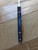 Blemished Yojimbo 2 folding knife with thumb hole - close up of back side of knife shown.  Satin SPY27 stainless steel plain edge blade.  Blue G-10 handle.  Model C85GPCBL2.