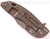 Rick Hinderer Knives XM-18 3.5" Bowie folding knife with thumb stud and flipper tab - shown closed lock side.  Working Finish 20CV stainless steel plain edge blade.  Coyote G-10 handle with Battle Bronze titanium lock side.  Model K2032SGW00.