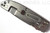 Rick Hinderer Knives Firetac Recurve folding knife with thumb disk - shown closed lock side.  Stonewash 20CV stainless steel plain edge blade.  Black G-10 handle with stonewash lock side.  Model K205FSGS00.