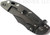 Rick Hinderer Knives XM-18 3.5" Bowie folding knife with thumb stud and flipper tab - shown closed lock side.  Battle Black 20CV stainless steel plain edge blade.  OD green - black G-10 handle with Battle Black titanium lock side.  Model K20320SNNC.