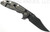 Rick Hinderer Knives XM-18 3.5" Bowie folding knife with thumb stud and flipper tab - shown open lock side.  Battle Black 20CV stainless steel plain edge blade.  Black G-10 handle with Battle Black titanium lock side.  Model K20320SNNC.