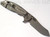 Rick Hinderer Knives XM-18 3.0" Skinner folding knife with thumb studs and flipper tab - shown open lock side.  Working Finish 20CV stainless steel plain edge blade.  Black G-10 handle with Working Finish lock side.  Model K1041SGW00.