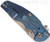 Rick Hinderer Knives Jurassic Spear Point folding knife with thumb stud and flipper tab - shown closed lock side.  Stonewash 20CV stainless steel plain edge blade.  Blue - black G-10 handle with stonewash blue lock side.  Model K208JSGS00.
