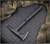 RMJ Tactical Kestrel tomahawk - shown out of sheath reverse.  Black Cerakote 80CRV2 steel plain edge head.  Black G-10 handle.