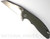 Rick Hinderer Knives XM-18 3.0" Wharncliffe folding knife with thumb stud and flipper tab - shown open presentation side.  Stonewash 20CV stainless steel plain edge blade.  OD green G-10 handle with stonewash lock side.  Model KXM3000WC.