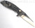 Rick Hinderer Knives XM-18 3.0" Wharncliffe folding knife with thumb stud and flipper tab - shown open lock side.  Stonewash 20CV stainless steel plain edge blade.  OD green G-10 handle with stonewash lock side.  Model KXM3000WC.
