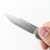 Tactile Knife Co Bexar slip joint folding knife with nail nick - close up of obverse blade.  Stonewash MagnaCut stainless steel plain edge blade.  Titanium handle.  Model 20-BX-MC01-TT01.