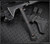 RMJ Tactical Ragnarok 12 tomahawk - shown out of sheath reverse.  Graphite Black Cerakote 80CRV2 steel plain edge head.  Black G-10 handle.  Model T-R12-GB-BL.