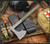 RMJ Tactical Raven tomahawk - shown out of sheath reverse.  Tungsten Cerakote 80CRV2 steel plain edge head.  Dirty Olive G-10 handle.