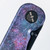Tactile Knife Co Seasonal Release Deep Space Rockwall folding knife with thumb stud - shown close up of pivot.  Black MagnaCut stainless steel plain edge blade.  Deep Space themed titanium handle.
For reference only.