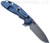 Rick Hinderer Knives XM-24 Spanto folding knife with thumb stud and flipper tab - shown open lock side.  Working Finish S45VN stainless steel plain edge blade.  Blue G-10 handle with Battle Blue lock side.  Model KXM40SPAN.
