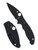 Spyderco Manix 2 Salt folding knife with thumb hole - shown both open presentation side and closed pocket clip side.  Black MagnaCut stainless steel plain edge blade.  Black G-10 handle.  Model C101GMCBKP2.