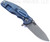 Rick Hinderer Knives Jurassic Hollow Grind Slicer folding knife with flipper tab - shown open lock side.  Working Finish MagnaCut stainless steel plain edge blade.  Blue G-10 handle scale with Battle Blue titanium lock side.  Model KJURSLHO.