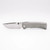 Chaves Knives Integral Redencion 229 folding knife featuring a thumb stud - shown open presentation side.  Belt Satin M390 stainless steel drop point style plain edge blade.  Titanium handle.  Model CK-1C1-1A1A-1A0!
