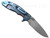 Rick Hinderer Knives XM-18 Skinny Slicer with thumb stud and flipper tab - shown open lock side.  Stonewash Magnacut stainless steel, hollow ground, plain edge blade.  Orange G-10 handle with stonewash blue lock side. 