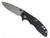 Rick Hinderer Knives XM-18 Skinny Slicer with thumb stud and flipper tab - shown open presentation side.  Working Finish Magnacut stainless steel, hollow ground, plain edge blade.  Black G-10 handle with Battle Green lock side. 