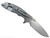 Rick Hinderer Knives XM-18 Skinny Slicer with thumb stud and flipper tab - shown open lock side.  Stonewash Magnacut stainless steel, hollow ground, plain edge blade.  Coyote Brown G-10 handle with stonewash lock side. 