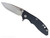 Rick Hinderer Knives XM-18 Skinny Slicer with thumb stud and flipper tab - shown open presentation side.  Stonewash Magnacut stainless steel, hollow ground, plain edge blade.  Black G-10 handle with stonewash bronze lock side. 