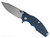 Rick Hinderer Knives Jurassic Hollow Grind Slicer folding knife with flipper tab - shown open presentation side.  Stonewash MagnaCut stainless steel plain edge blade.  Blue - black G-10 handle scale with stonewash titanium lock side.  Model KJURSLHO.