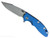 Rick Hinderer Knives XM-18 Skinny Harpoon Spanto with thumb stud and flipper tab - shown open presentation side.  Working Finish MagnaCut stainless steel plain edge blade.  Blue - black G-10 handle with Working Finish lock side.  Model KXM35SKHS.
