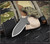 RMJ Tactical BUB Back Up Blade fixed blade knife - shown out of sheath reverse.  Tungsten Cerakote MagnaCut stainless steel plain double edge blade.  Dirty Olive G-10 handle.  Model K-BUB-MC-TU-DO.