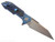 Rick Hinderer Knives Full Track Wharncliffe folding knife with flipper tab - shown open lock side.  Stonewash S45VN stainless steel plain edge blade.  Stonewash blue titanium with black G-10 scales.  Model KFTRWC.