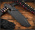 RMJ Tactical Sapper fixed blade knife - shown in sheath obverse.  Tungsten Cerakote 80CRV2 steel plain edge blade.  Black G-10 handle.  Model K-SAP-80CRV2-TU-BK.