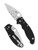 Spyderco Manix 2 folding knife with thumb hole - shown opened presentation side and closed pocket clip side.  MagnaMax stainless steel combo edge blade.  Black G-10 handle.  Model C101GPS2.