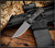 RMJ Tactical Utsidihi fixed blade knife - shown out of sheath reverse.  Tungsten Cerakote MagnaCut stainless steel plain edge blade.  Black G-10 handle.  Model K-UT-MC-TU-BK.