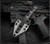 RMJ Tactical Utsidihi fixed blade knife - shown in sheath reverse.  Graphite Black Cerakote MagnaCut stainless steel plain edge blade.  Black G-10 handle.  Model K-UT-MC-GB-BK.