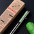 Tactile Turn Bolt Action ink pen - Seasonal Release Roswell edition.  Close up of pocket clip shown.  Overall length is 5.1" and features titanium construction with an UFO themed finish.  Model 10-BA2-SEA-ROS.
