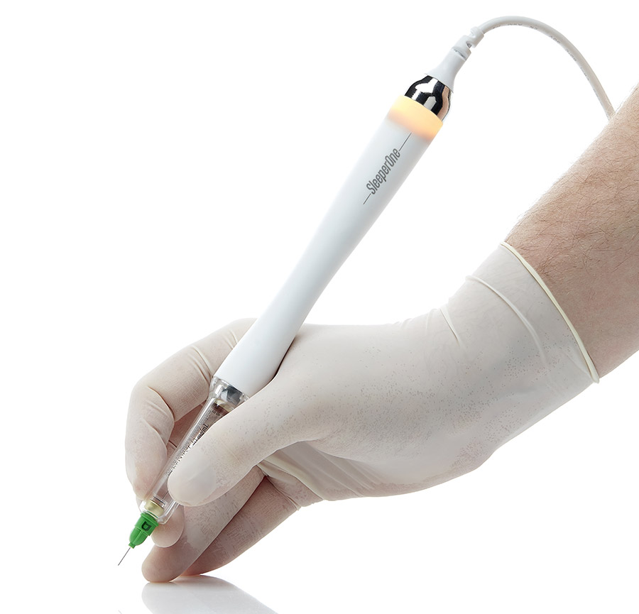 A close-up of a person's hand holding a syringe</p><p>
					Description automatically generated with low confidence