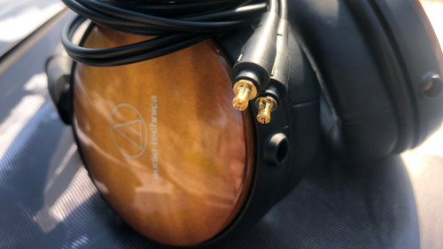Audio-Technica ATH-WP900 A2DC cable connection detail showing gold-plated connectors at earcup jack