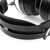Audeze MM-500 headband close-up showing black pebbled leather pressure strap, matte black spring steel frame, silver MM signature logo, knurled adjustment rod, white background