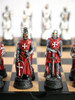 Themed Chess Set: Crusader Ceramic Chess Pieces on Black & Maple Chess Board with Storage close up red pieces