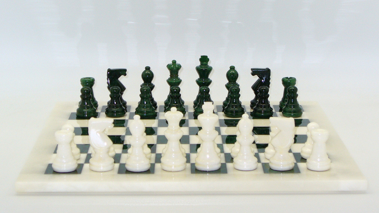 Chess Set: Freyr Green & White Chess Pieces on Matching Chess Board players angle