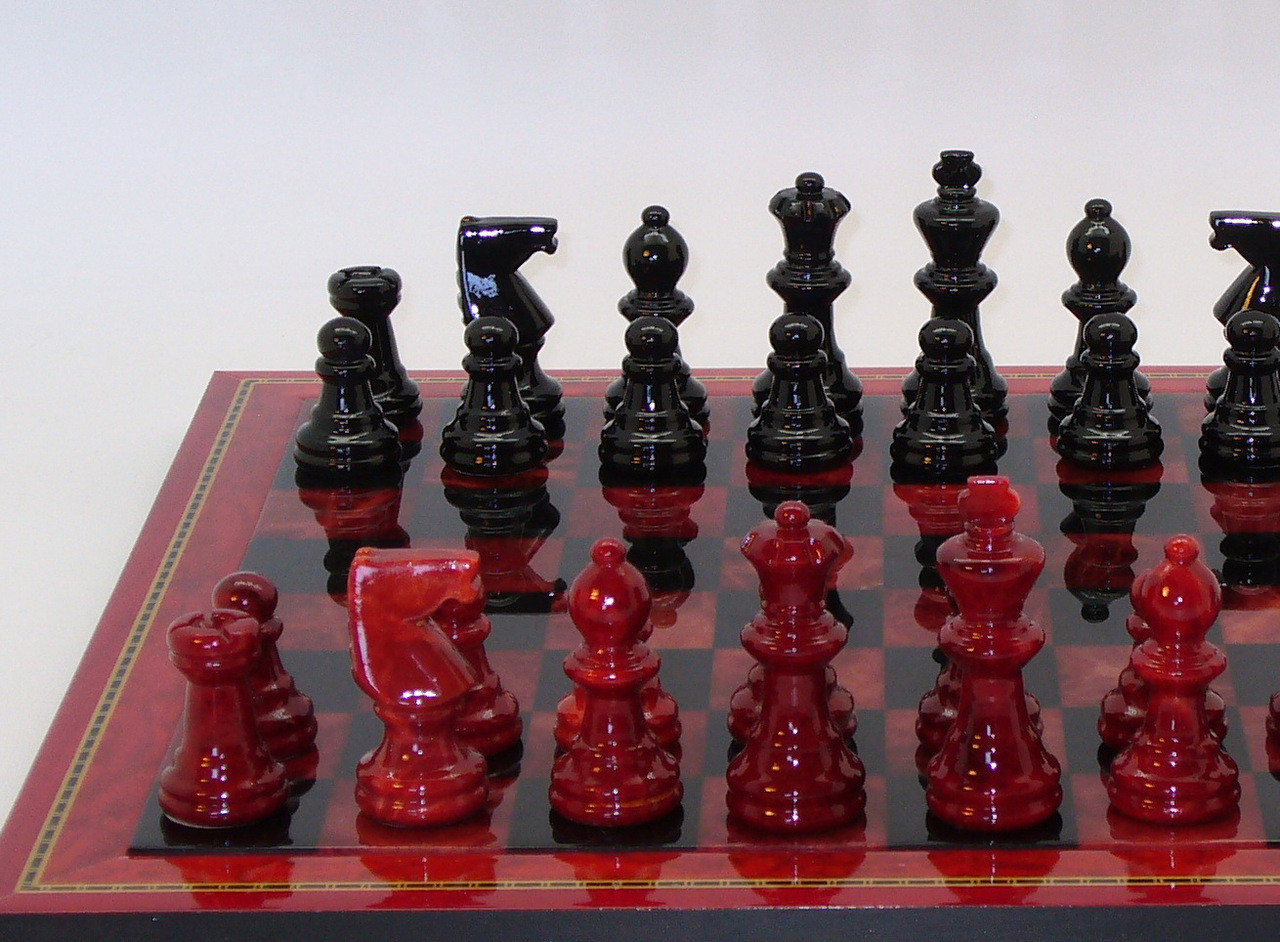 Chess Set: Dionysus Red & Black Alabaster Chess Pieces on Wood Framed Chess Board close up 