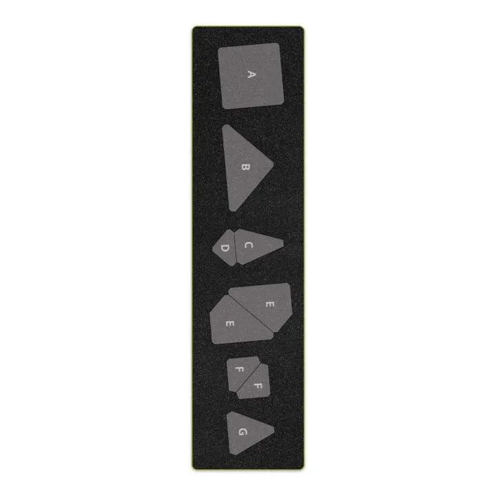 Sewing pattern template pieces labeled with letters on a dark background.