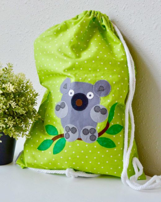 pq11557-cuddle-me-koala-cinch-bag-lifestyle-web