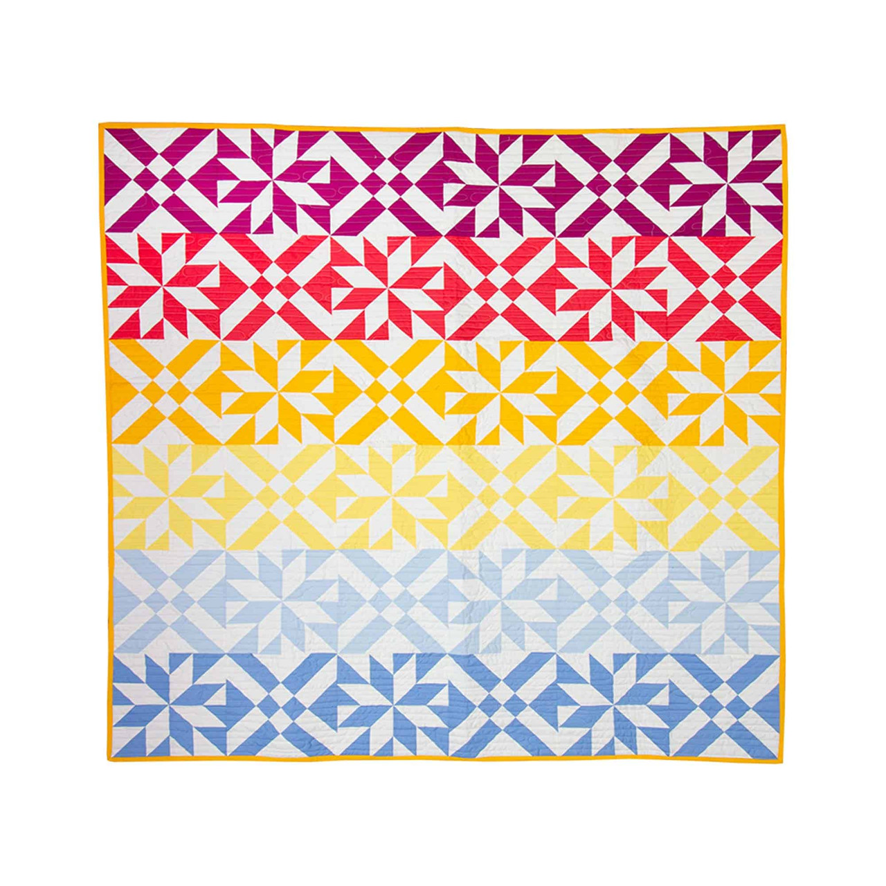 Colorful geometric quilt showcasing precision fabric cutting techniques.