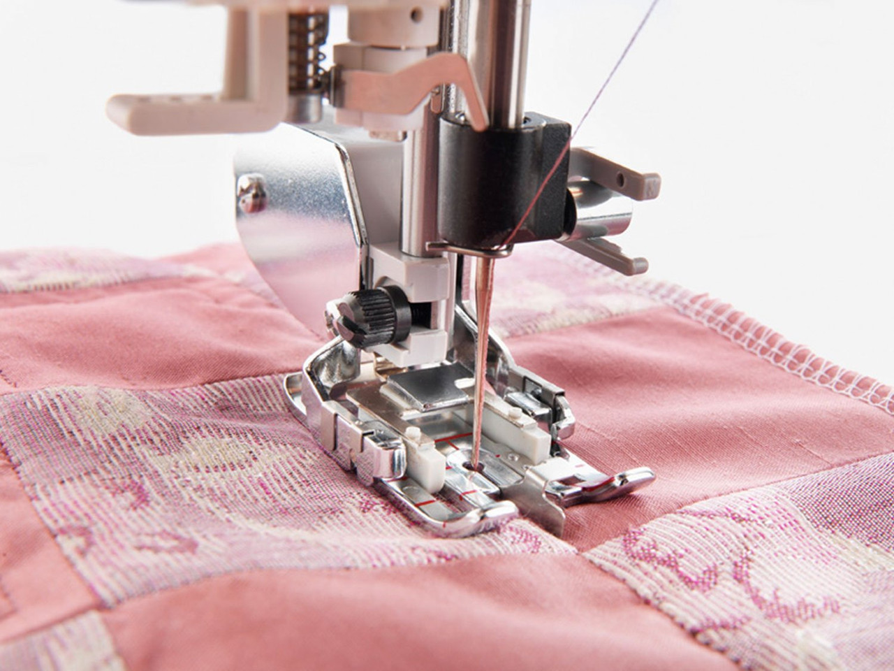 Husqvarna Viking changeable quilters guide foot sewing pink quilted fabric - quilting foot
