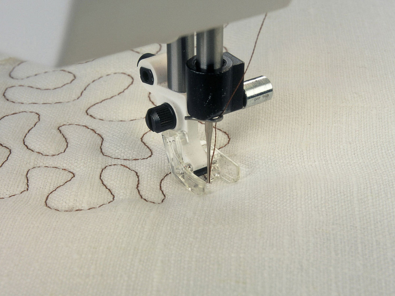 Clear open-toe free-motion quilting foot - brown thread pattern on white fabric - Husqvarna Viking